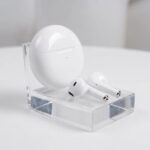 White_wireless_earbuds_on_stand_20261017191557