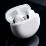 Wireless_earbuds_on_glass_surface_20261017191413